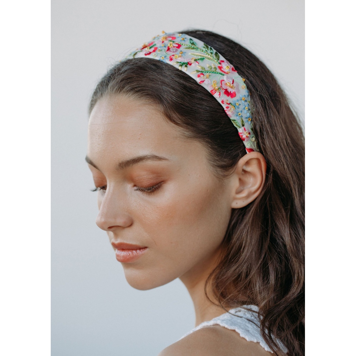 The Laine Headband is made by hand in New York from grosgrain featuring hand embroidery and lined in silk charmeuse to ensure ultimate comfort and promote hair health. We recommend storing headbands in their dust bag while not in use. Avoid contact with water