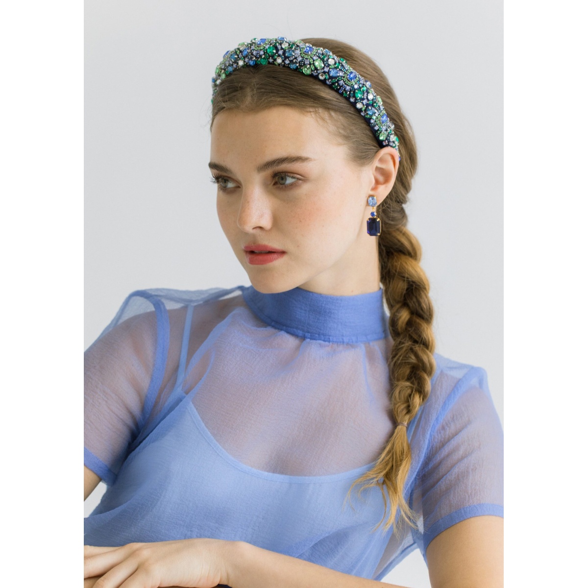 The Mimi Headband is made in New York of hand-embroidered crystals on a flexible and comfortable silk lined headband base. We recommend treating this headband as you would a piece of jewelry