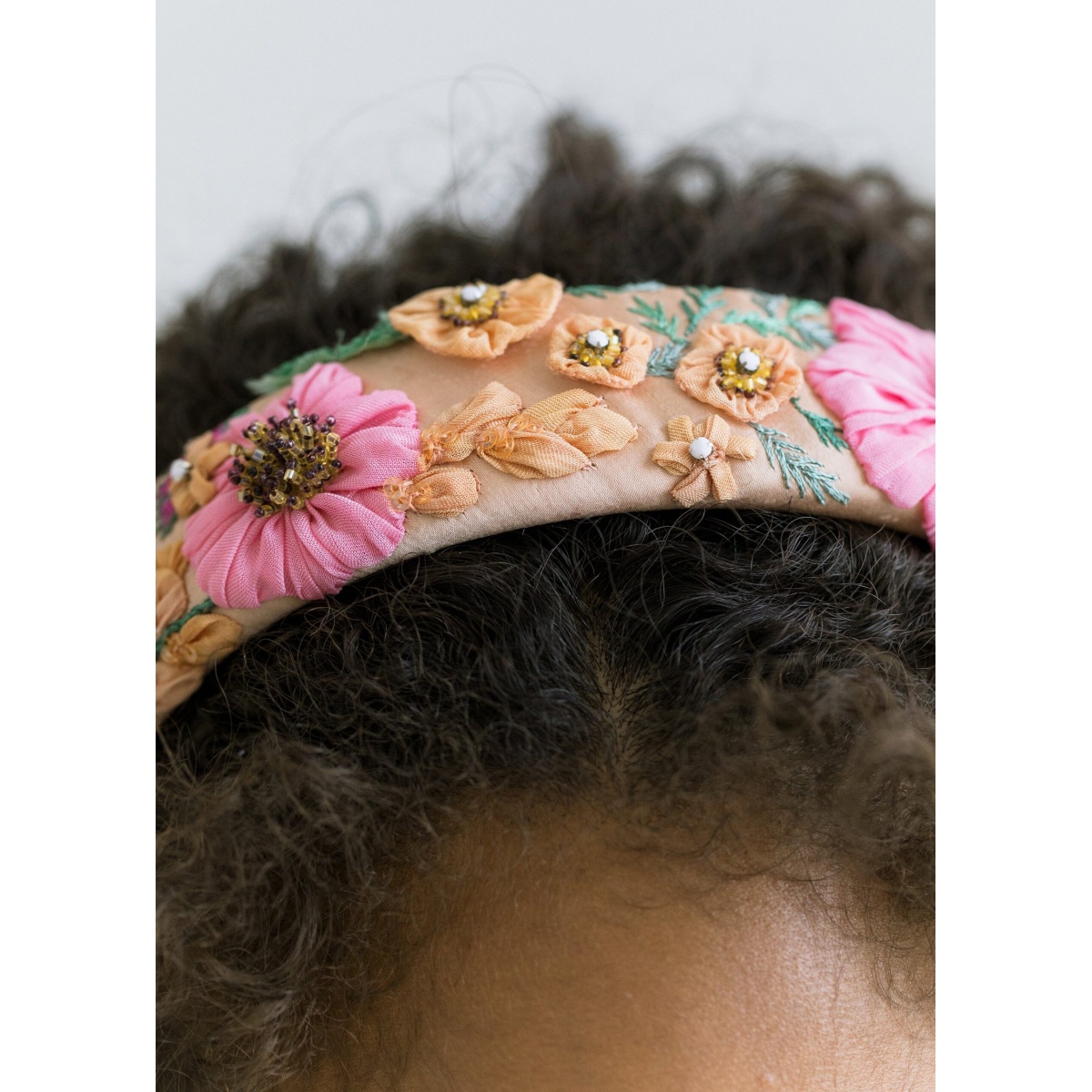 The Sheryl Headband is made by hand in New York of hand-dyed fabric and crystal embellishment