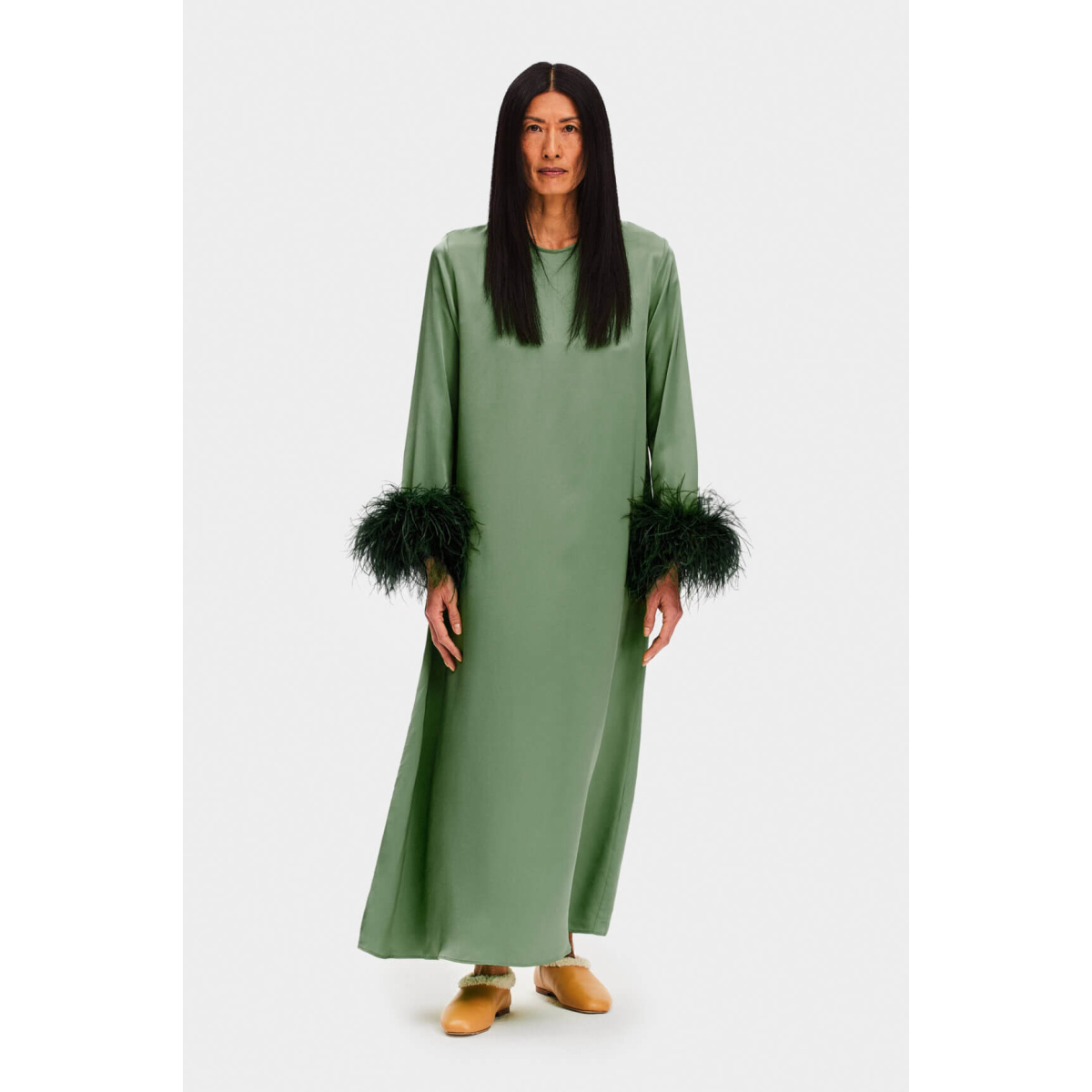 Green dress with outlet feathers