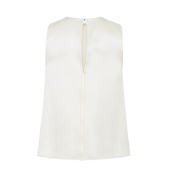 the Elias Top flows with effortless ease in a sleeveless silhouette that falls gracefully from the shoulders.