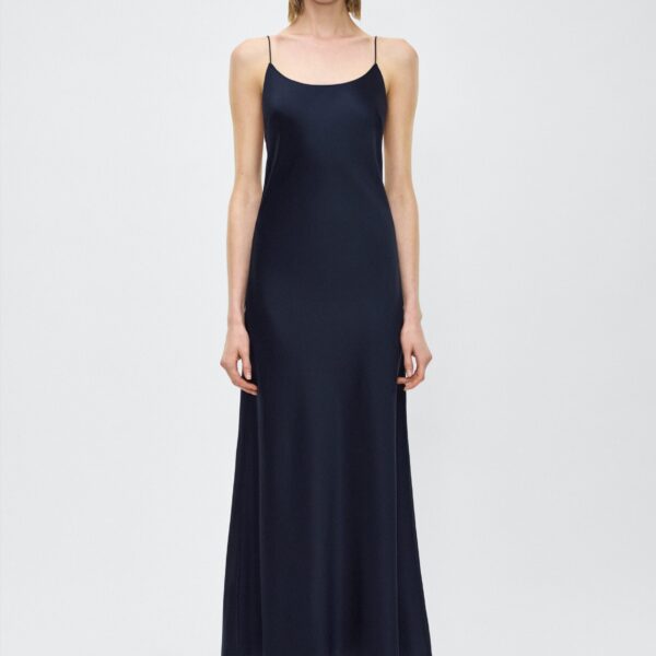 with the top featuring a button loop and diamond monogram mother of pearl buttons to hold the dress in place.