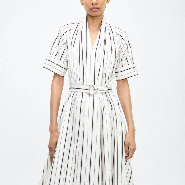 while a fabric belt cinches the waist for a defined silhouette.