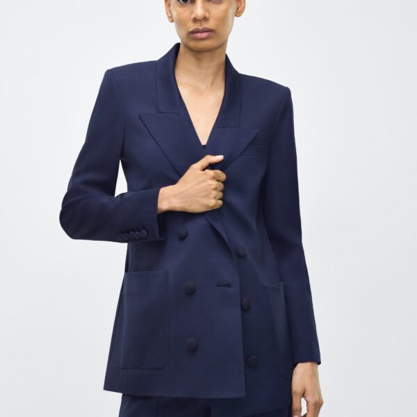 it’s finished with covered buttons for a refined
