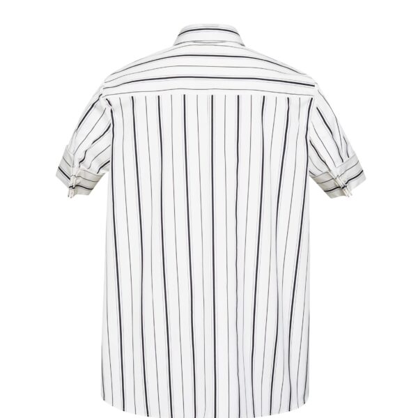 this season’s version features a classic ivory and black stripe. The piece features diamond monogram mother of pearl buttons along the center front placket
