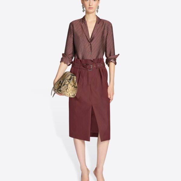 with belt and irregular pleats.