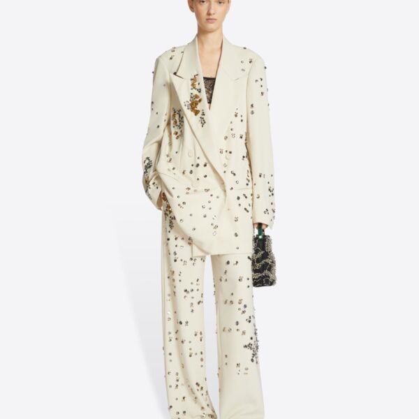 in embellished virgin wool gabardine.
