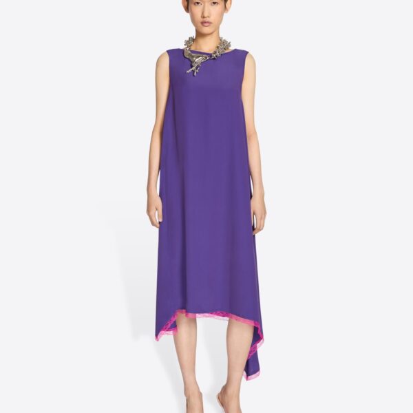 with asymmetrical hem and contrast lace trim.