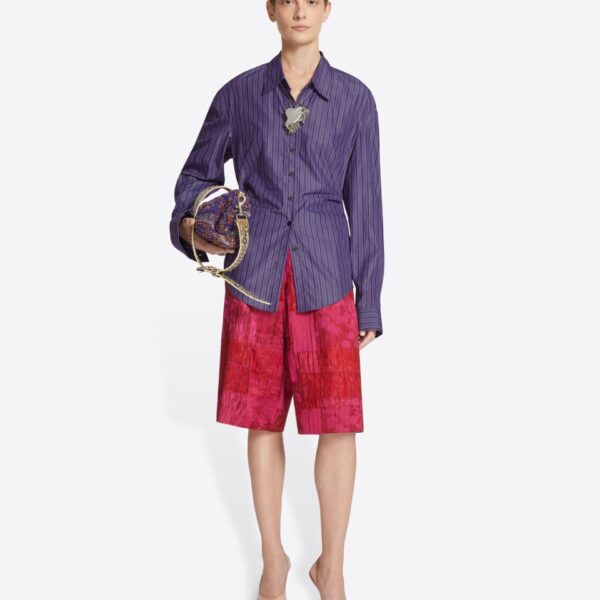 in striped cotton poplin. Can be worn closed all the way down or styled halfway buttoned.