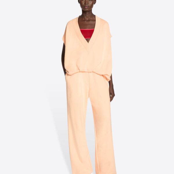 with pleats towards the hemline.