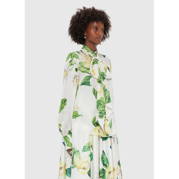 Leo Lin White Tops Delicate daisies and camellias are hand-painted onto a fresh white canvas. Playful cobalt blue butterflies flutter irregularly across the print