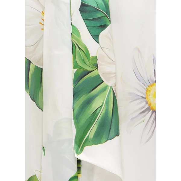 Leo Lin White Tops Delicate daisies and camellias are hand-painted onto a fresh white canvas. Playful cobalt blue butterflies flutter irregularly across the print
