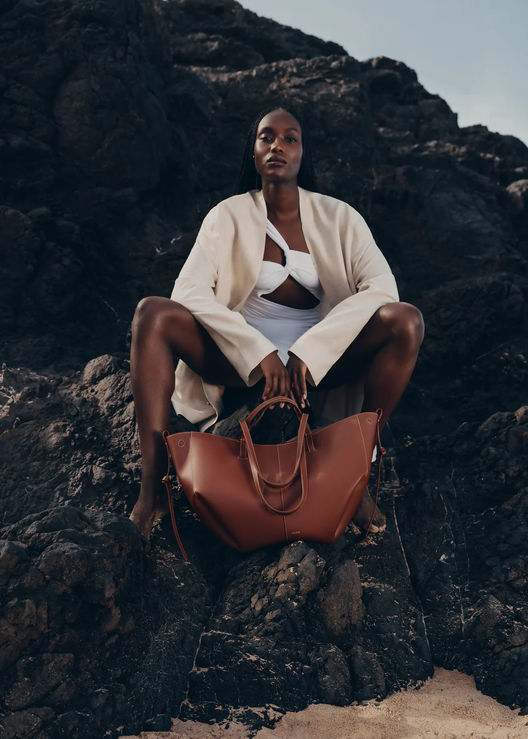 Polène Cyme Large travel bag styled with linen coords and sneakers