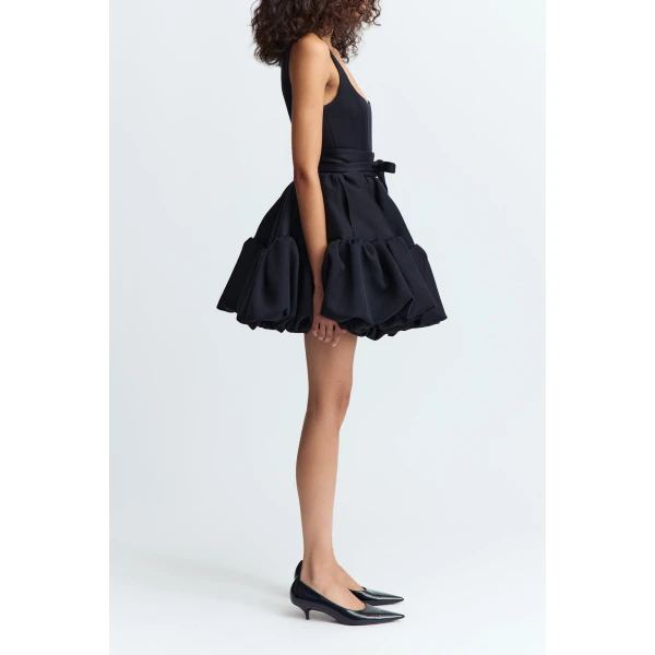 a cinched waist accentuated by a tailored belt