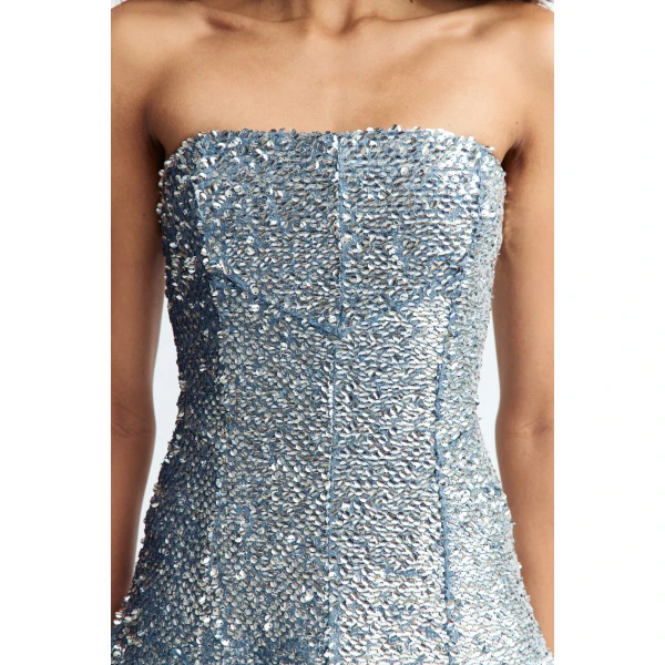 it flares into a sculptural bubble peplum skirt