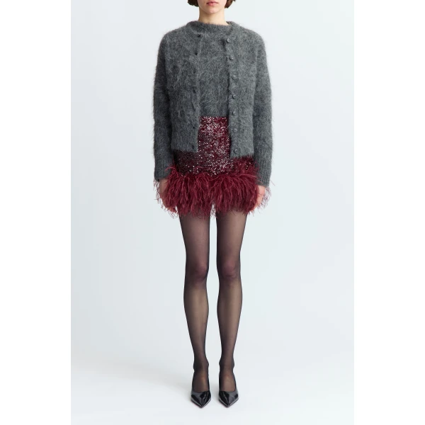 offering rich depth and a subtle shimmer. Cut to fall high above the knee