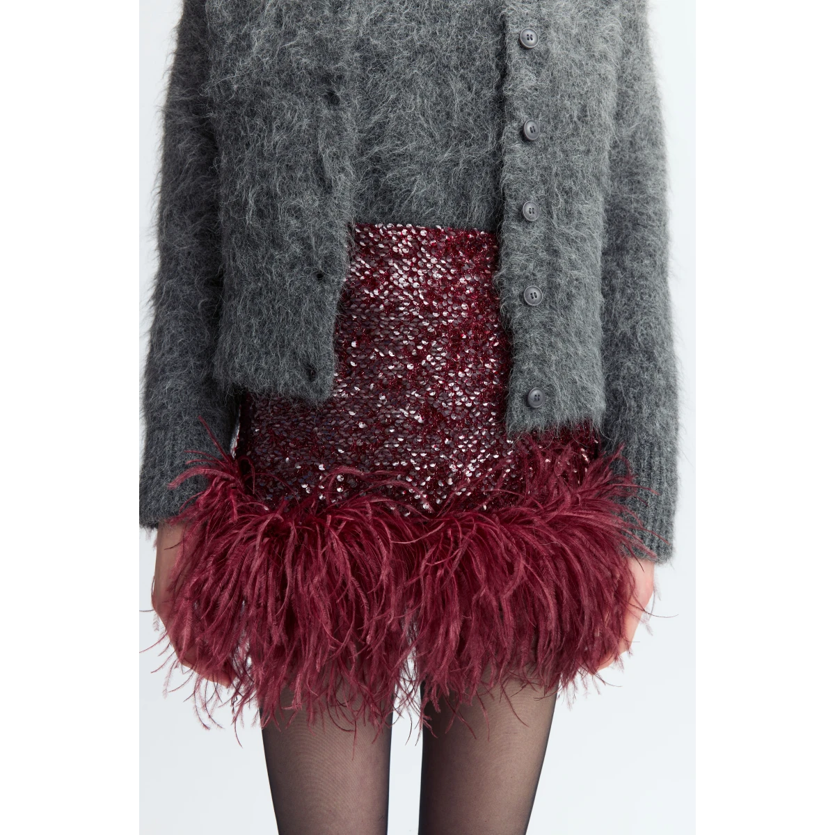it's finished with a feathered hem that adds softness and movement to its clean