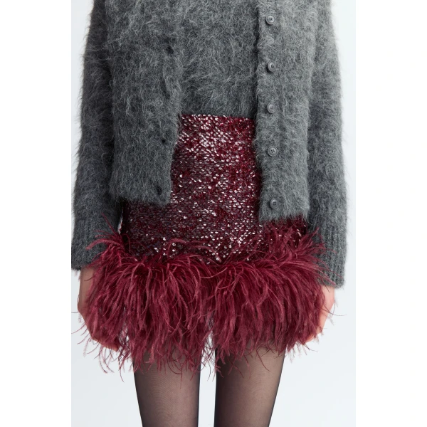 it's finished with a feathered hem that adds softness and movement to its clean