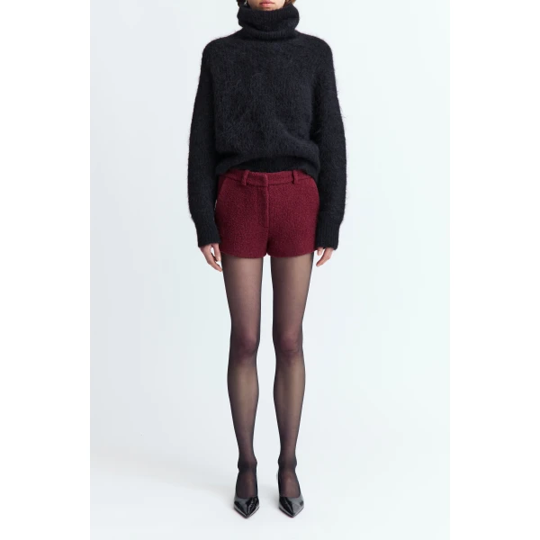 offering a textured finish with a refined feel. Designed to fall high above the knee