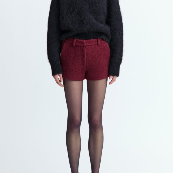 offering a textured finish with a refined feel. Designed to fall high above the knee
