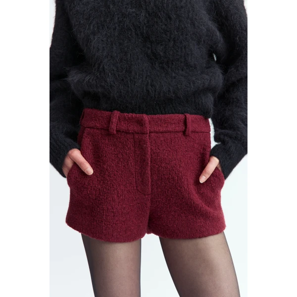 it features belt loops and four pockets - two at the front and two welt pockets at the back; combining functionality with tailored structure.