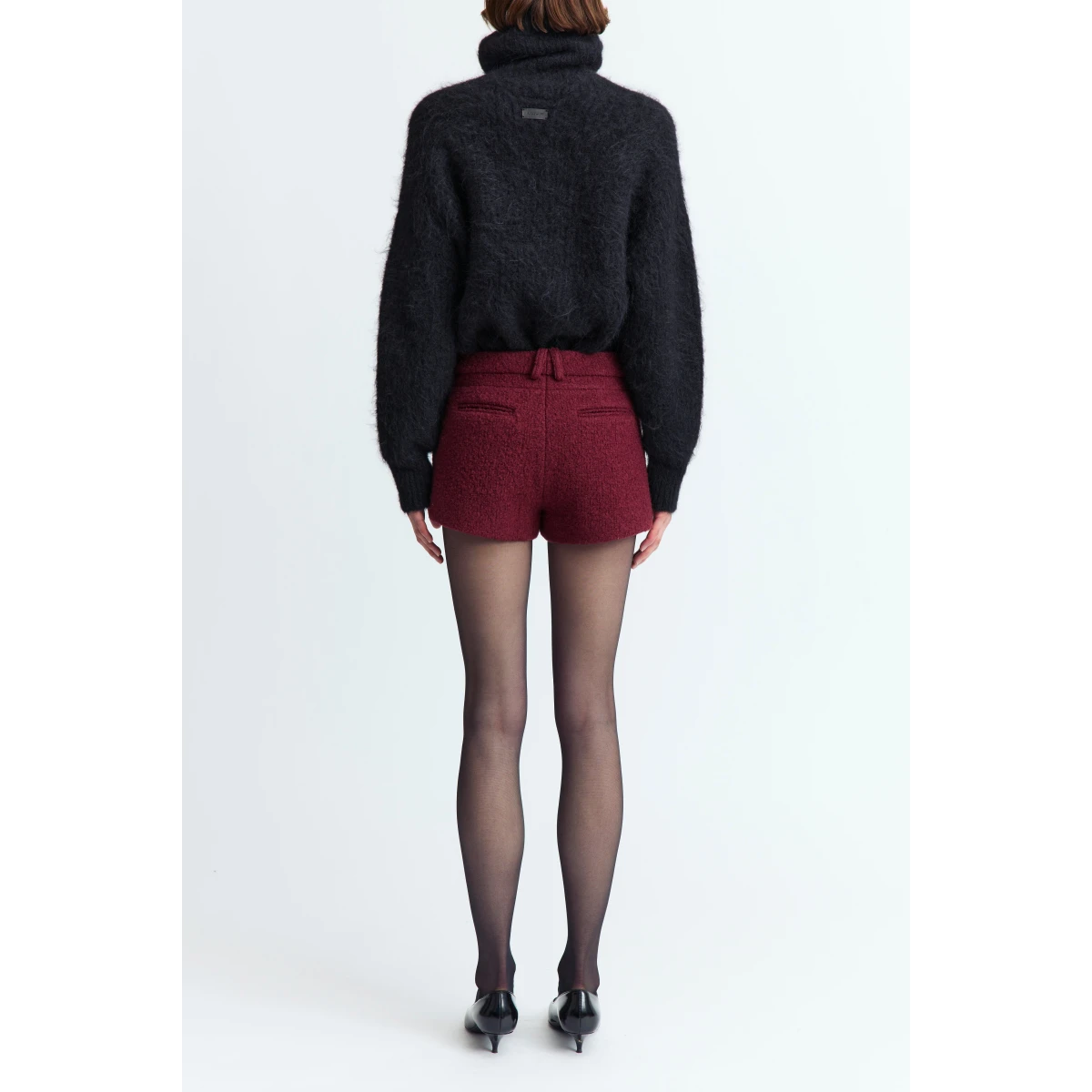 offering a textured finish with a refined feel. Designed to fall high above the knee