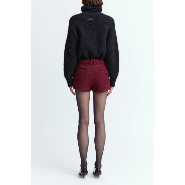 offering a textured finish with a refined feel. Designed to fall high above the knee