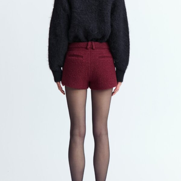 offering a textured finish with a refined feel. Designed to fall high above the knee