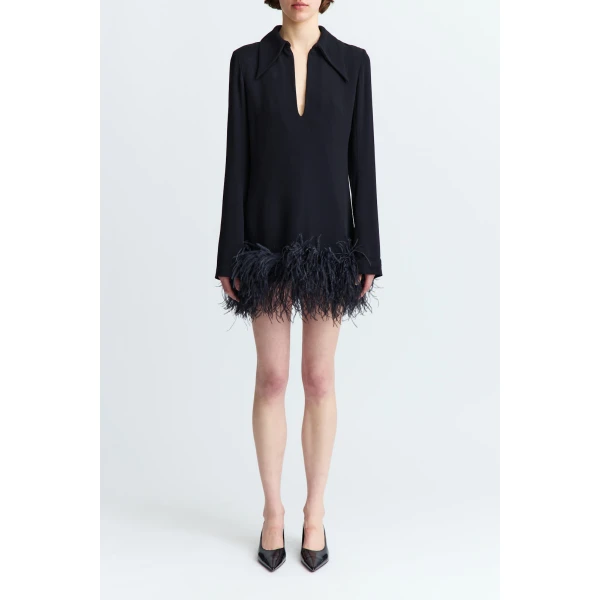 defined by an exaggerated collar and a narrow plunge split at the chest. Mini in length with long sleeves