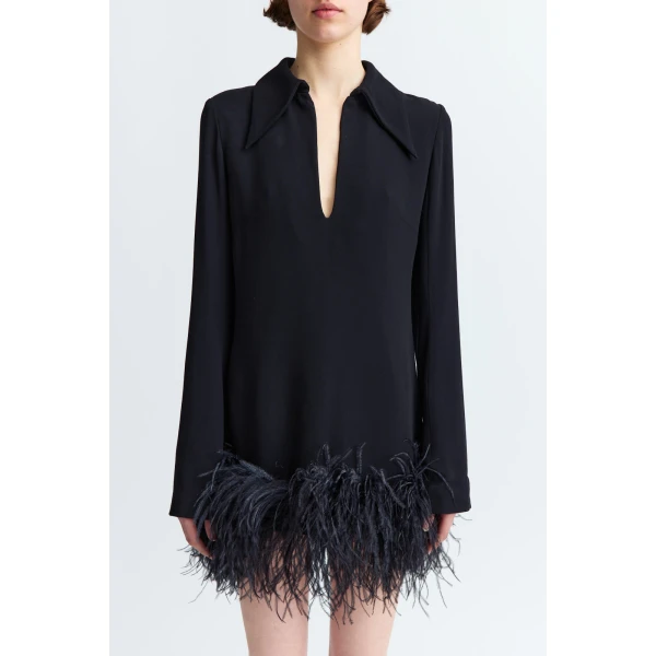 it finishes with a feathered hem that adds movement and contrast to its sharp lines.