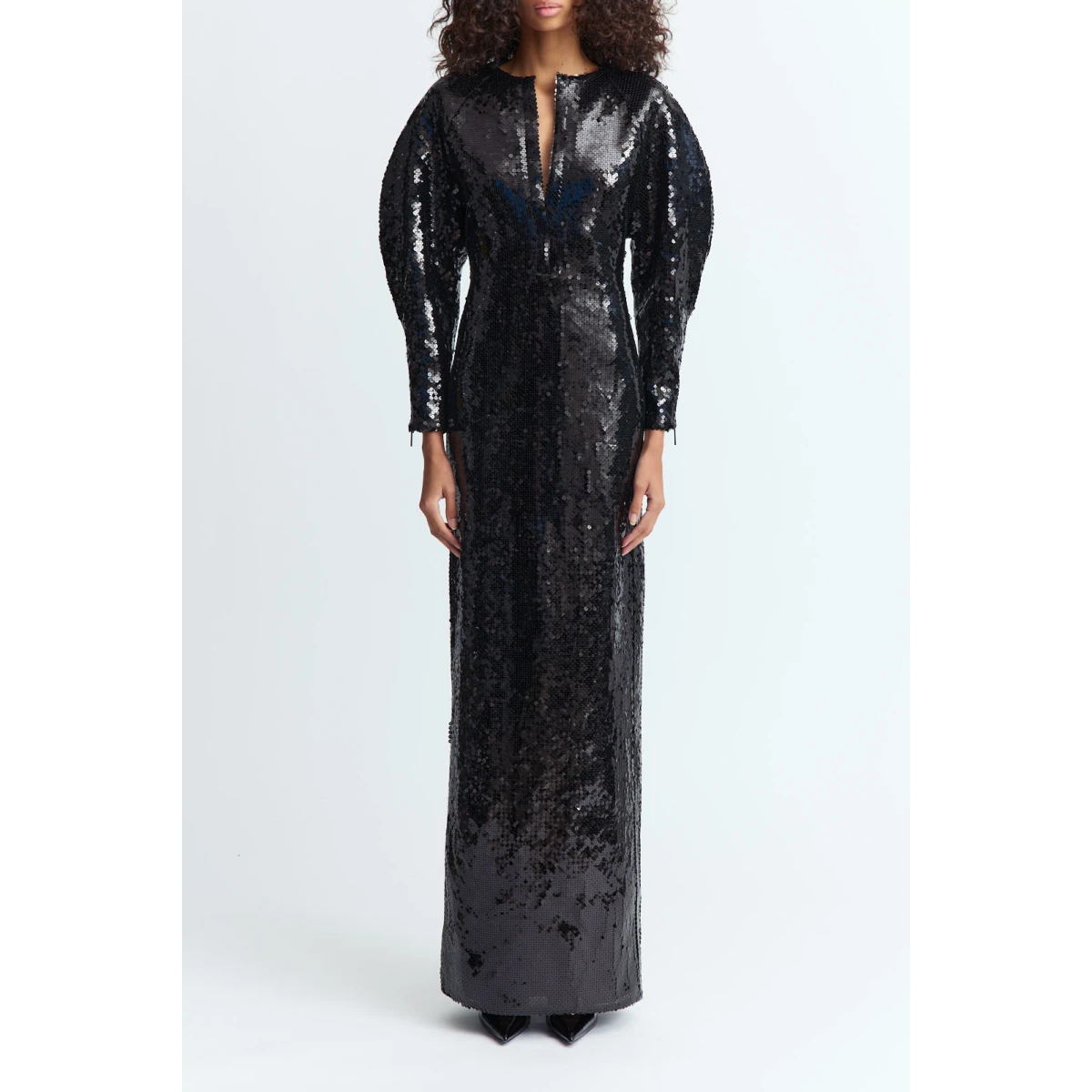 floor-length silhouette cut from black sequins with a subtle