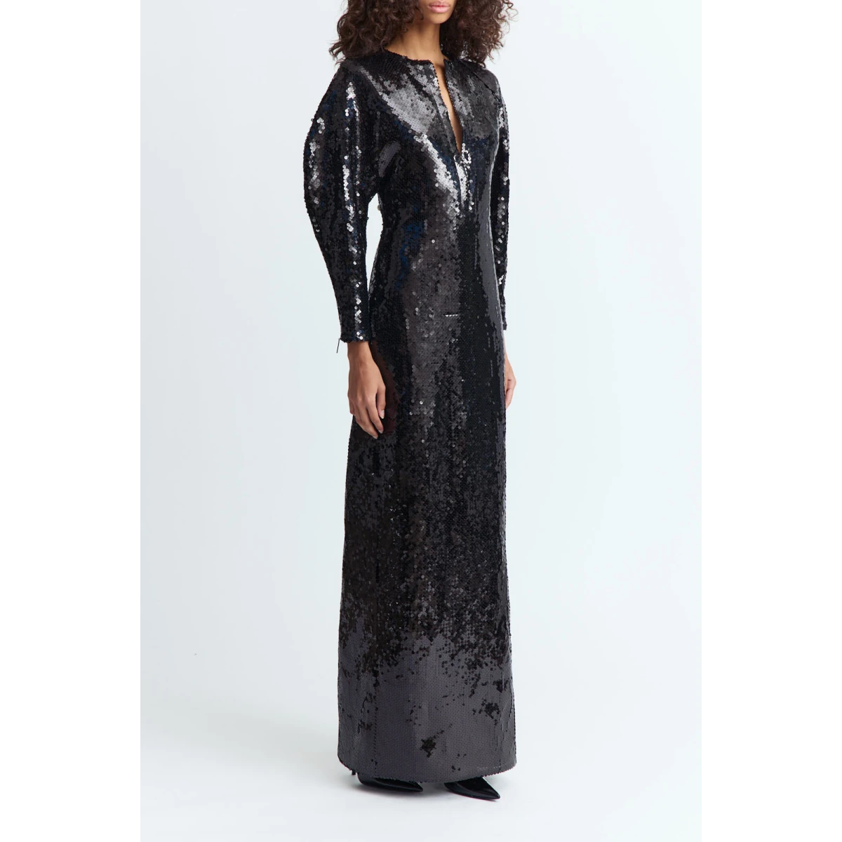 it brings quiet drama and refined glamour to evening dressing.