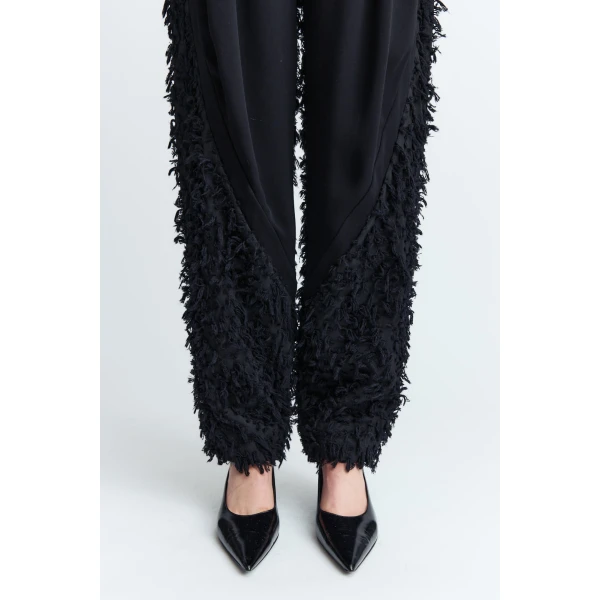 enhanced by darts that extend from the waist down for a clean
