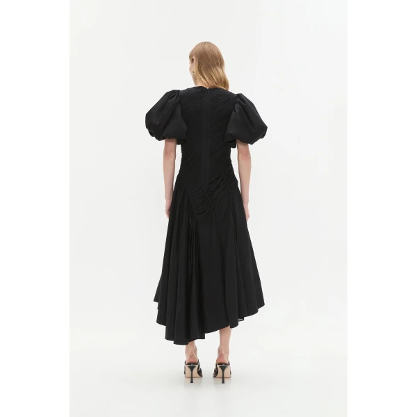 Aje Aus Dresses – structured silhouette with raw femininity from Coveti