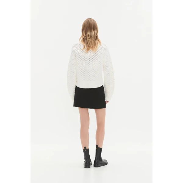 Aje clothing Aus Knitwear – structured silhouette with raw femininity from Coveti