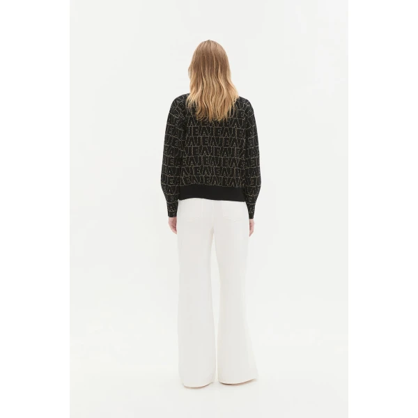 Aje clothing Aus Knitwear – structured silhouette with raw femininity from Coveti