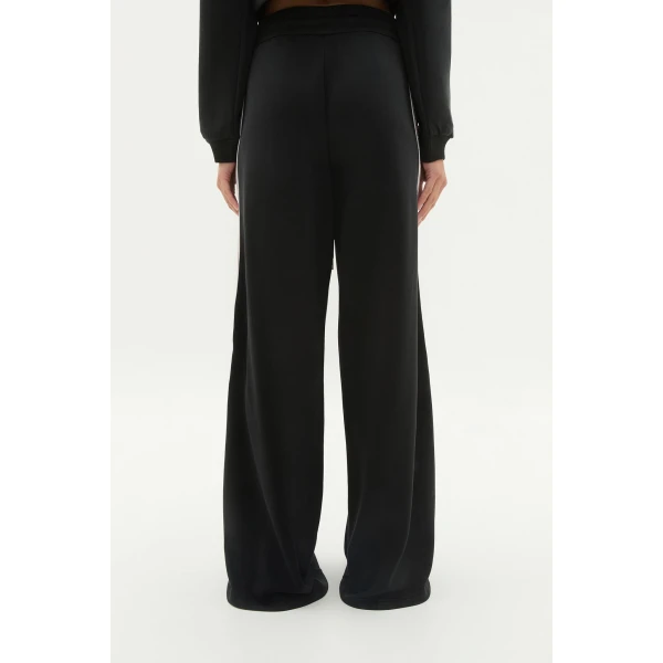 Aje Aus Pants – structured silhouette with raw femininity from Coveti