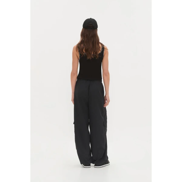 Aje clothing Aus Tops – structured silhouette with raw femininity from Coveti