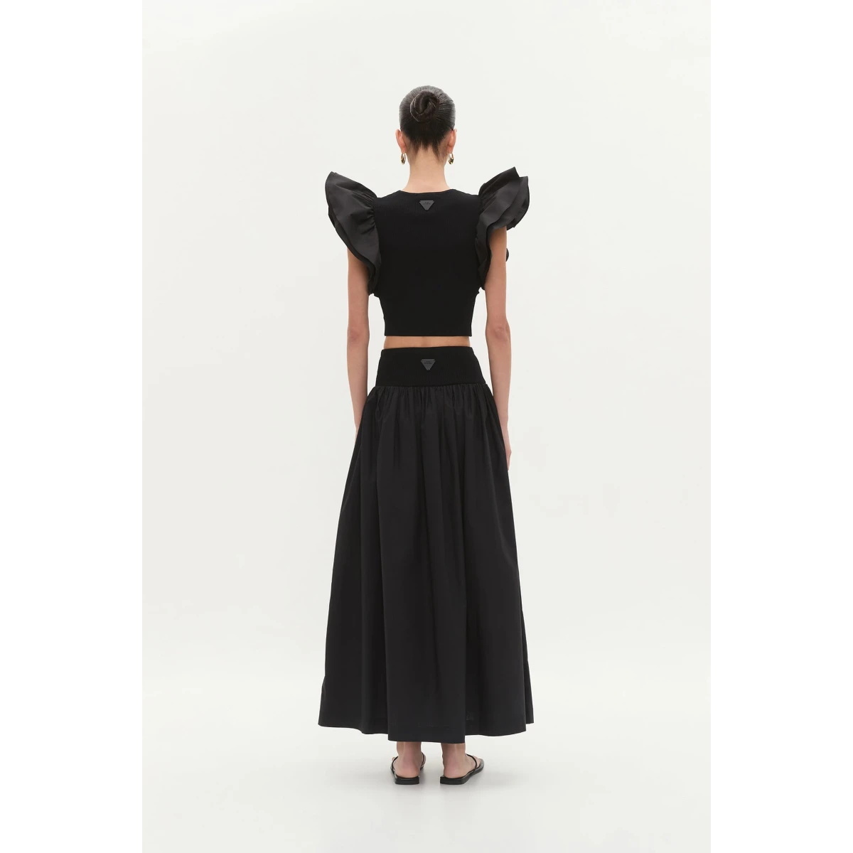 Aje clothing Aus Tops – structured silhouette with raw femininity from Coveti