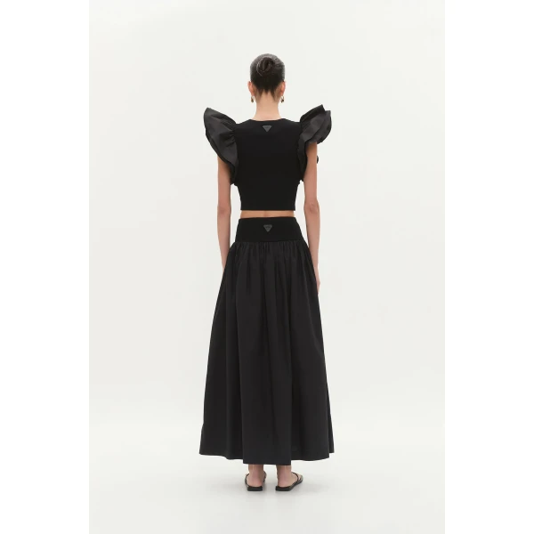 Aje clothing Aus Tops – structured silhouette with raw femininity from Coveti