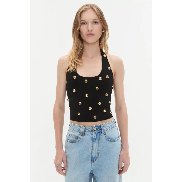 Aje Aus Tops – structured silhouette with raw femininity from Coveti