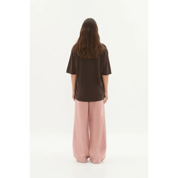 Aje clothing Aus Tops – structured silhouette with raw femininity from Coveti