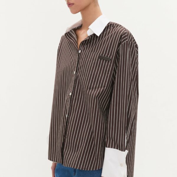 Aje Aus Tops – structured silhouette with raw femininity from Coveti