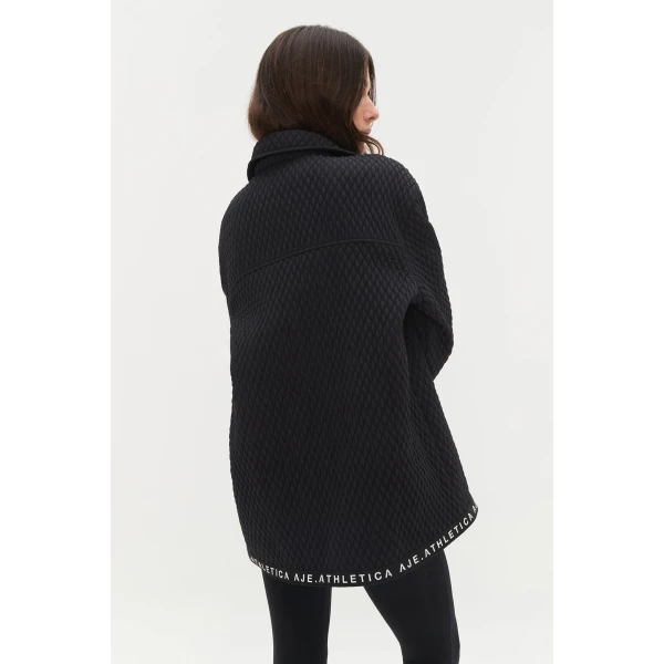 Aje Aus Tops – structured silhouette with raw femininity from Coveti