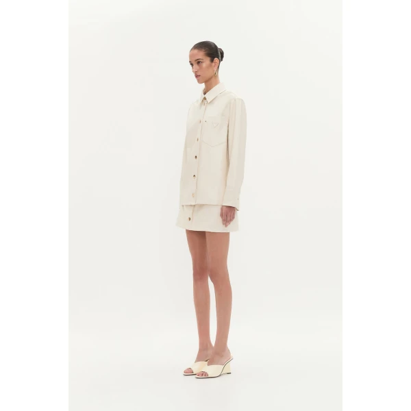 Aje Aus Tops – structured silhouette with raw femininity from Coveti