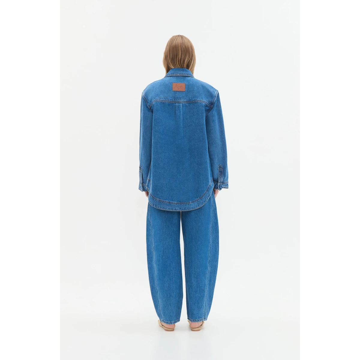 Aje clothing Aus Tops – structured silhouette with raw femininity from Coveti