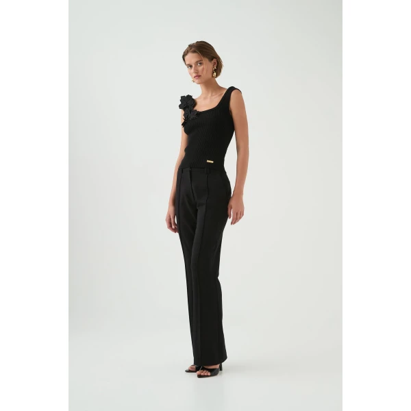Aje Aus Tops – structured silhouette with raw femininity from Coveti