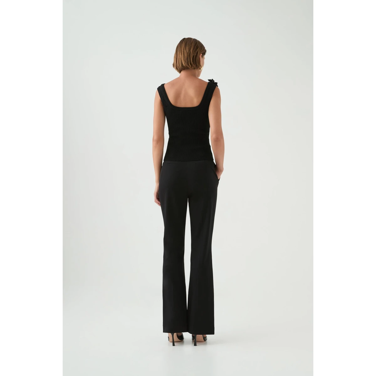 Aje clothing Aus Tops – structured silhouette with raw femininity from Coveti