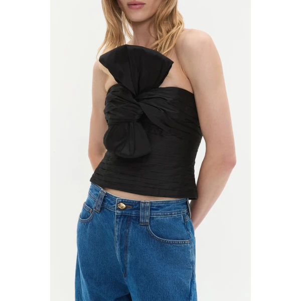 Aje Aus Tops – structured silhouette with raw femininity from Coveti