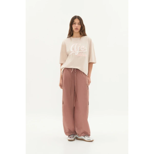 Aje clothing Aus Tops – structured silhouette with raw femininity from Coveti